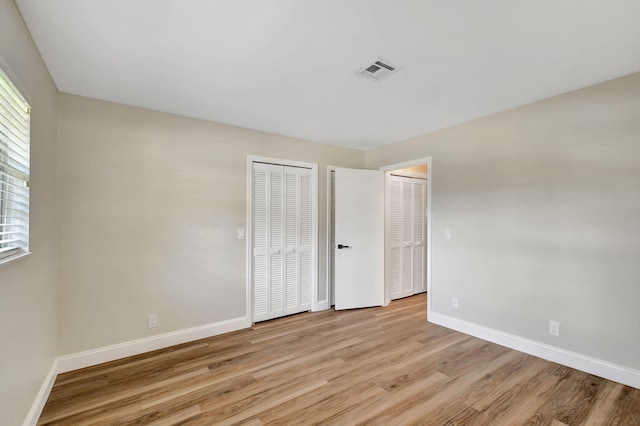 unfurnished bedroom featuring light hardwood / wood-style flooring