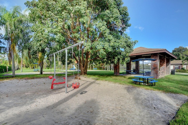 view of playground with a gazebo and a lawn