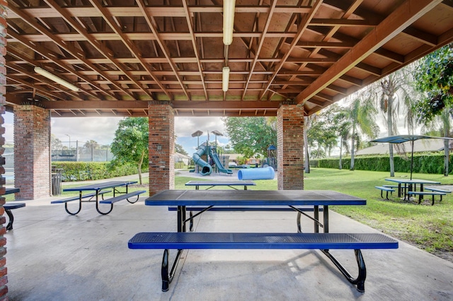 surrounding community featuring a lawn and a playground