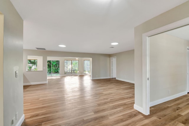 unfurnished living room with light hardwood / wood-style floors