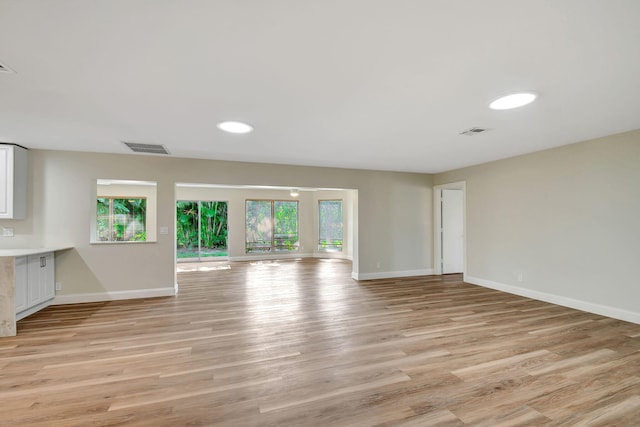 unfurnished living room with light wood-type flooring