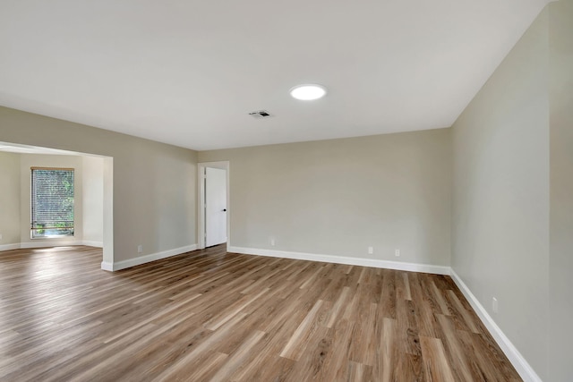 unfurnished room with light hardwood / wood-style flooring