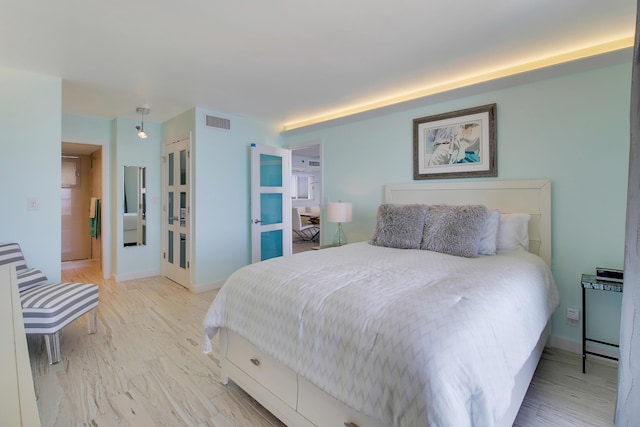 bedroom featuring light hardwood / wood-style floors and a closet