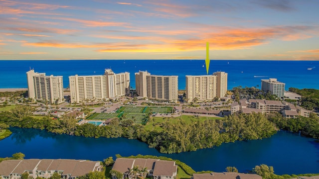 aerial view at dusk with a water view