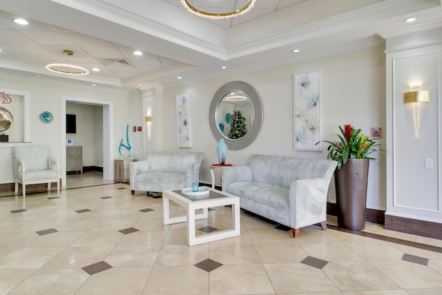 living room with light tile patterned floors, crown molding, and a tray ceiling