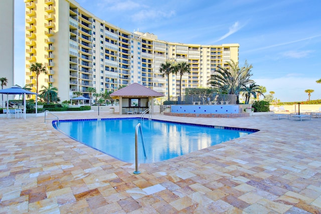 view of swimming pool featuring a gazebo and a patio