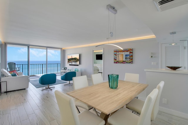 dining space featuring expansive windows