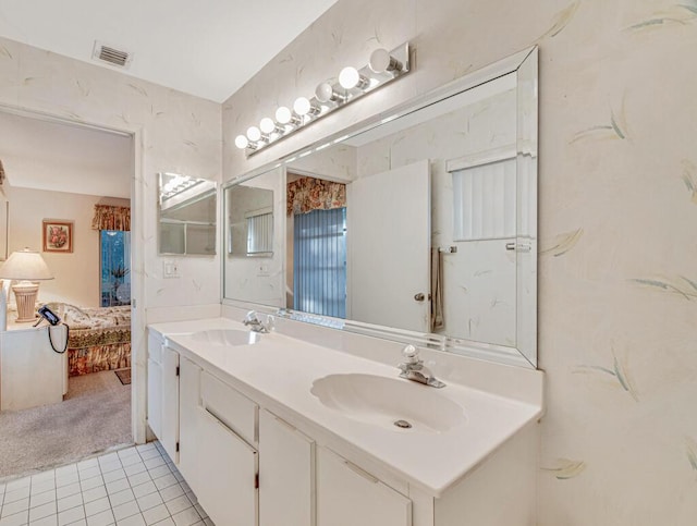 bathroom featuring tile patterned flooring and vanity