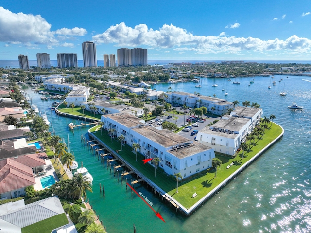 birds eye view of property with a water view