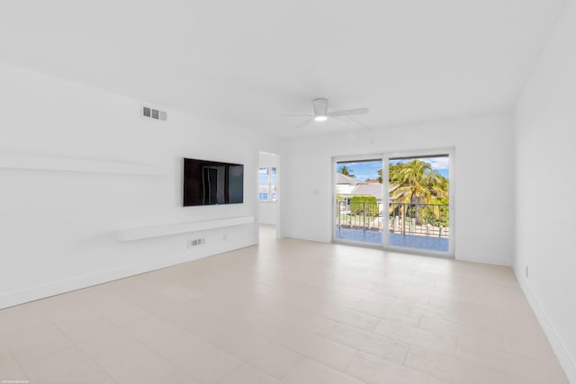 unfurnished living room featuring ceiling fan