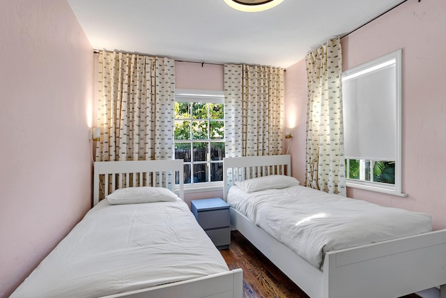 bedroom featuring dark hardwood / wood-style flooring