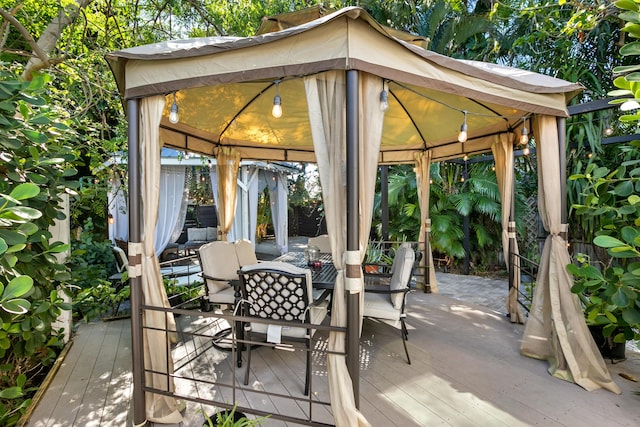 view of patio / terrace featuring a gazebo and a wooden deck