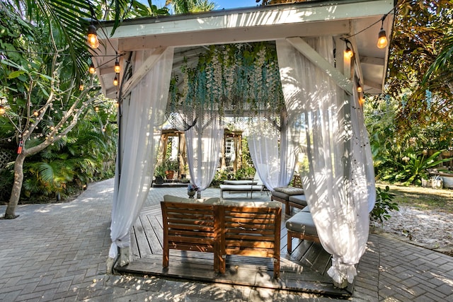 view of patio featuring an outdoor living space and a gazebo