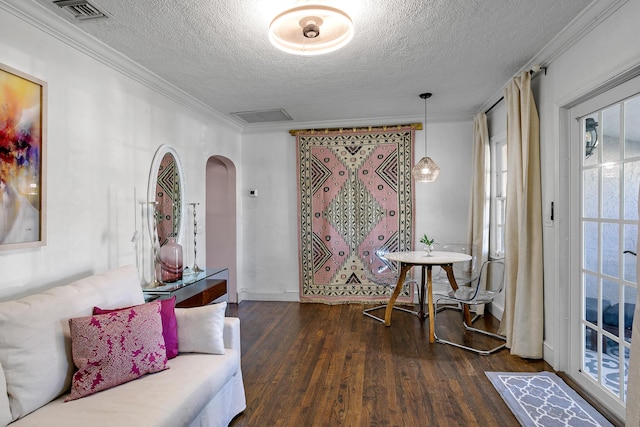 interior space with crown molding, a textured ceiling, and dark hardwood / wood-style flooring