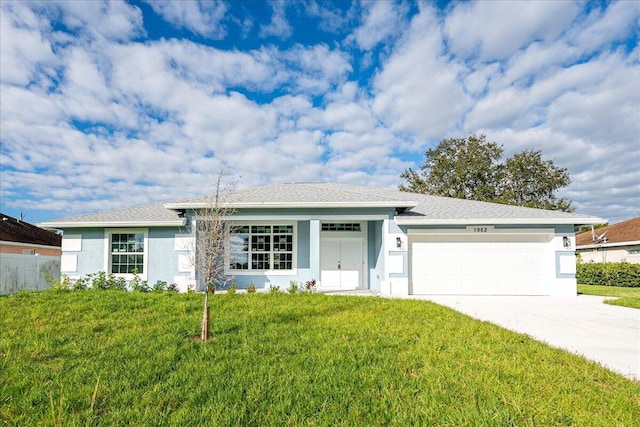 single story home with a front lawn and a garage