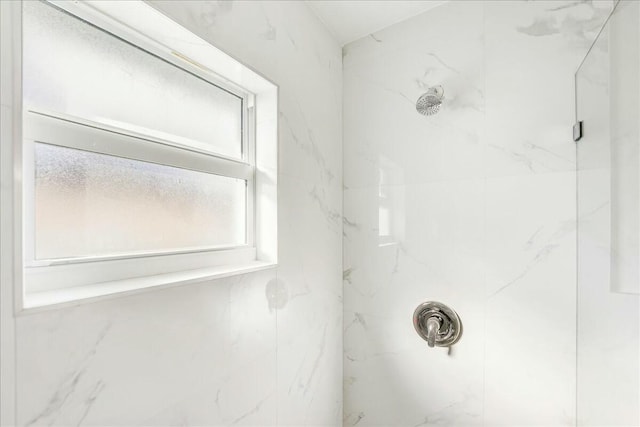 bathroom with tiled shower