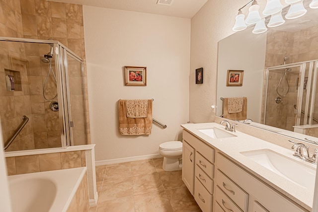 full bathroom featuring vanity, tile patterned floors, toilet, and separate shower and tub