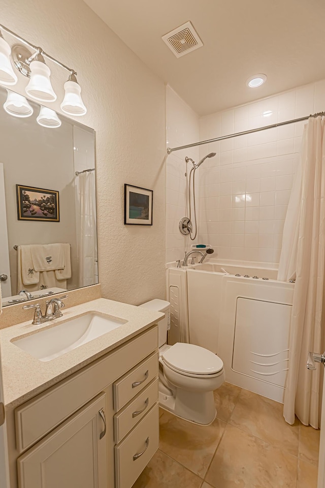 full bathroom featuring shower / bathtub combination with curtain, vanity, tile patterned flooring, and toilet