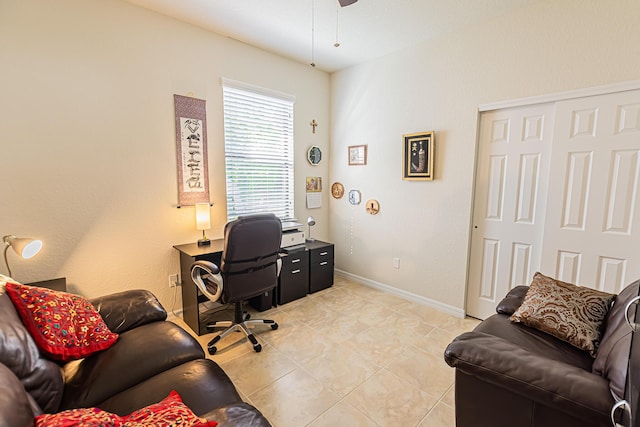 office area with ceiling fan and light tile patterned floors