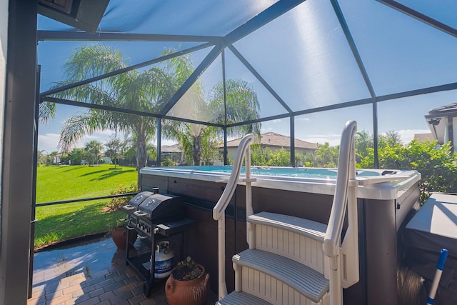 view of patio featuring a hot tub and glass enclosure