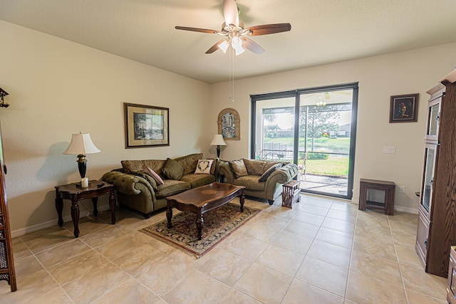 living room with ceiling fan and light tile patterned floors