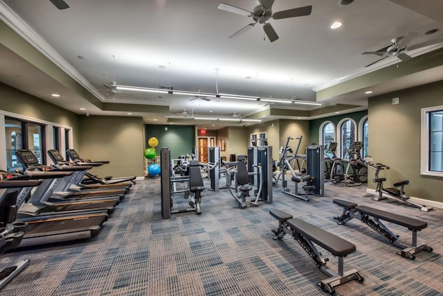 workout area with crown molding, carpet, and ceiling fan