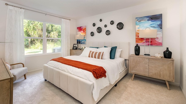 4601 SW Savona Blvd, Port Saint Lucie, FL 34953 - bedroom with baseboards and light colored carpet