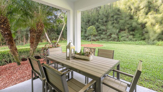 4601 SW Savona Blvd, Port Saint Lucie, FL 34953 - view of patio featuring outdoor dining space