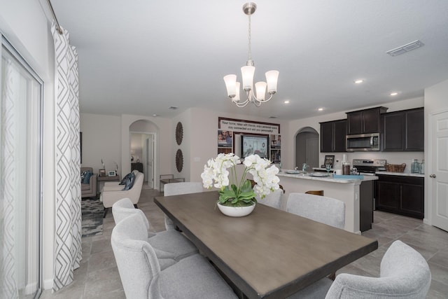 dining space featuring a chandelier