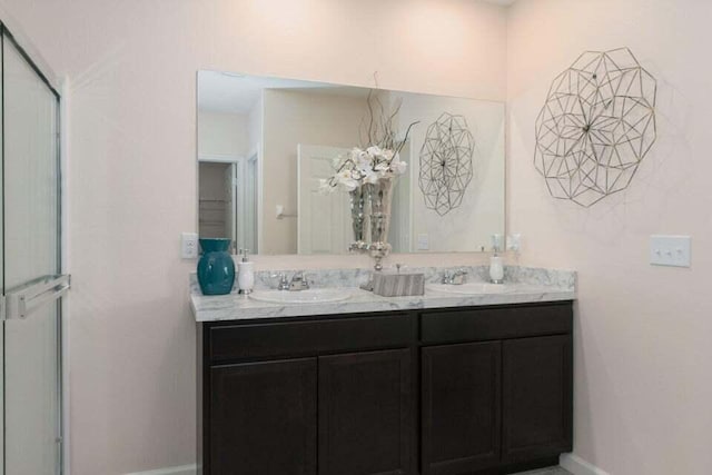 bathroom with vanity and walk in shower