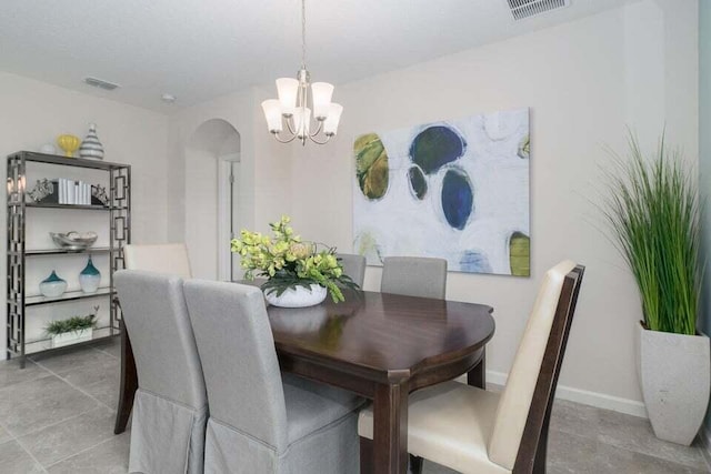 dining area featuring a chandelier