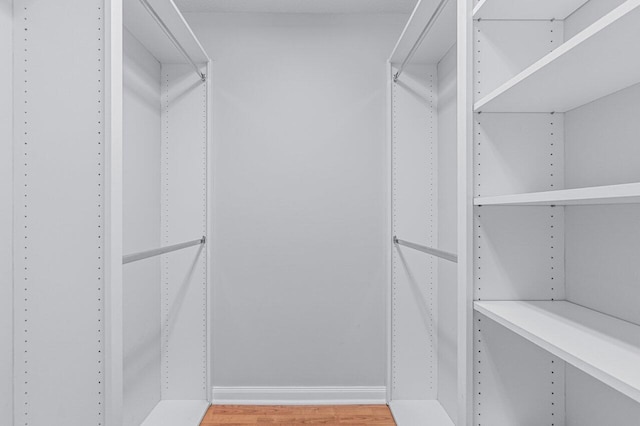 walk in closet featuring wood-type flooring