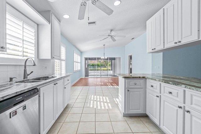 kitchen with stainless steel dishwasher and white cabinets