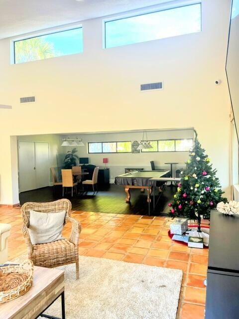 living room with a high ceiling