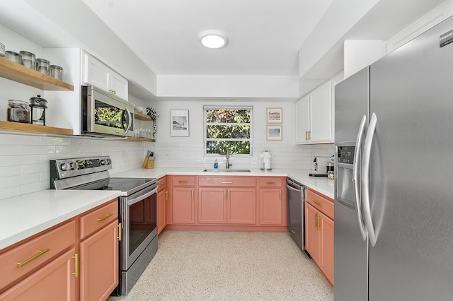 kitchen with backsplash, sink, and stainless steel appliances