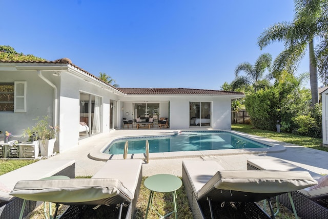 view of swimming pool with a patio