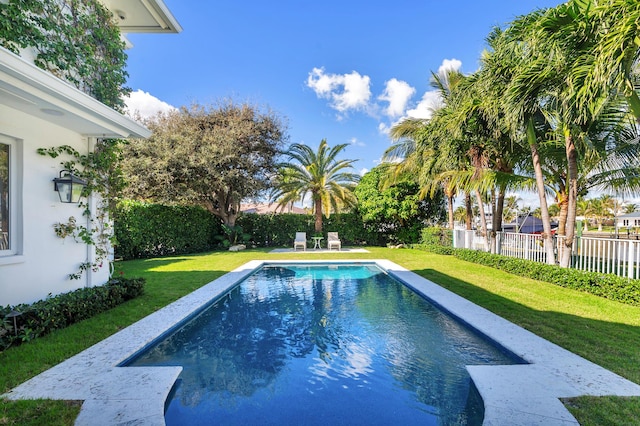 view of pool featuring a yard