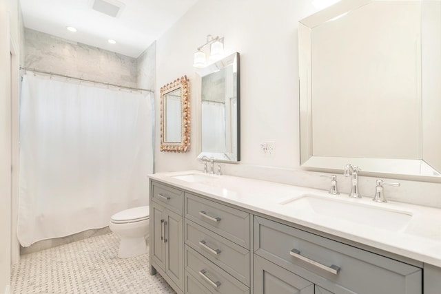 bathroom with a shower with curtain, vanity, toilet, and tile patterned flooring