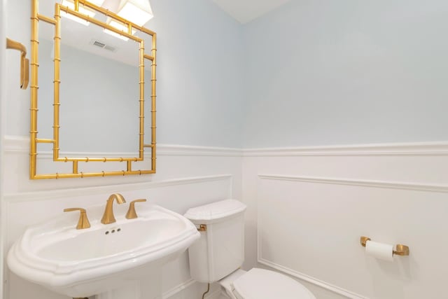 bathroom with sink and toilet