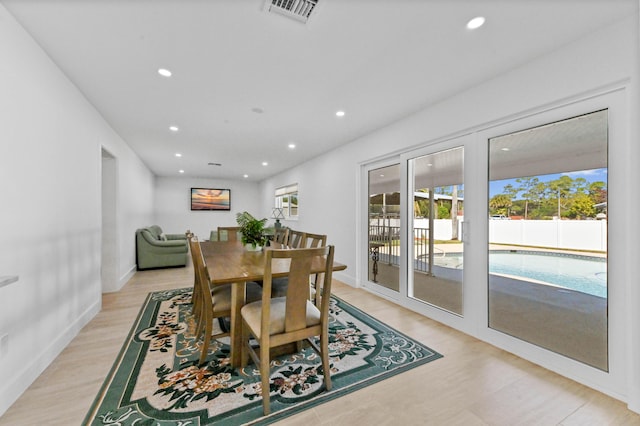 dining room with light hardwood / wood-style flooring