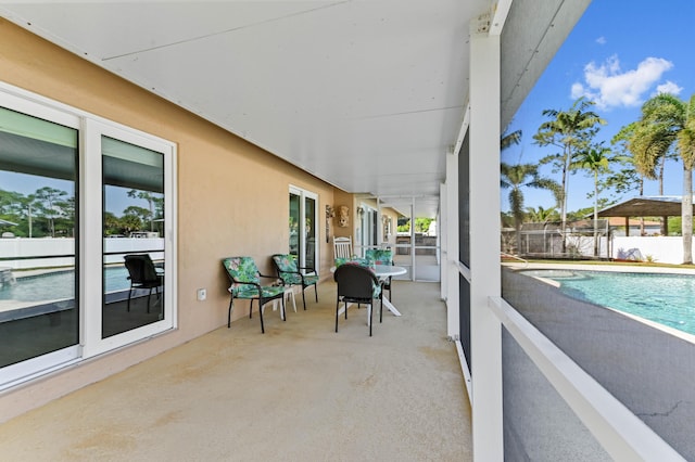 view of patio / terrace with a fenced in pool