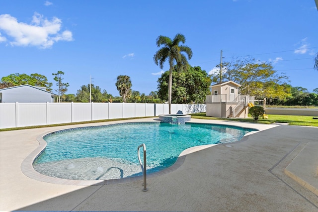 view of pool featuring a patio area and an in ground hot tub