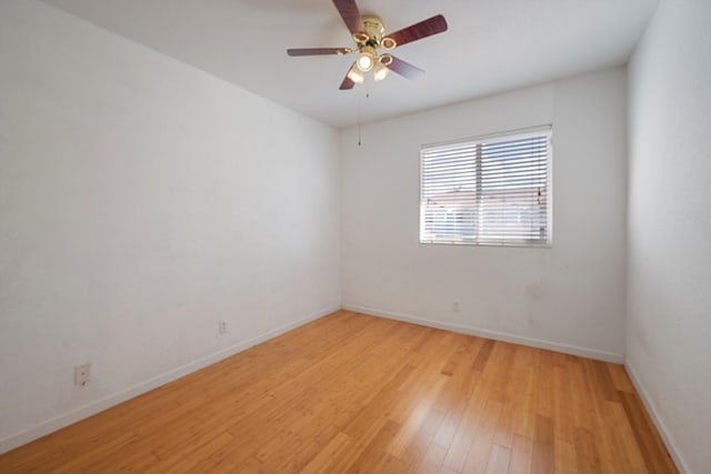 unfurnished room featuring light hardwood / wood-style flooring and ceiling fan