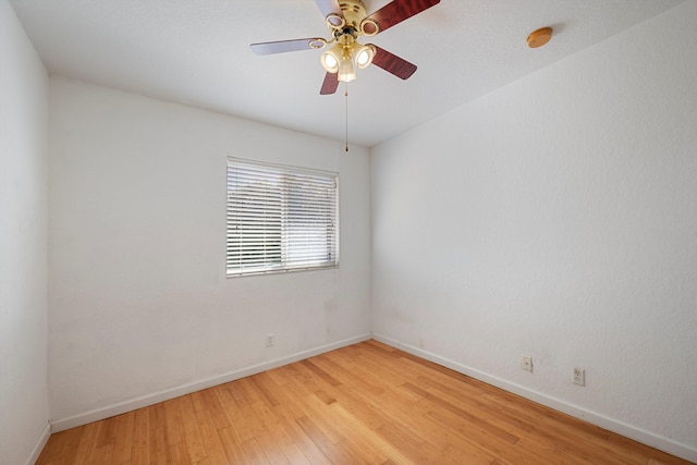 spare room featuring ceiling fan and hardwood / wood-style floors