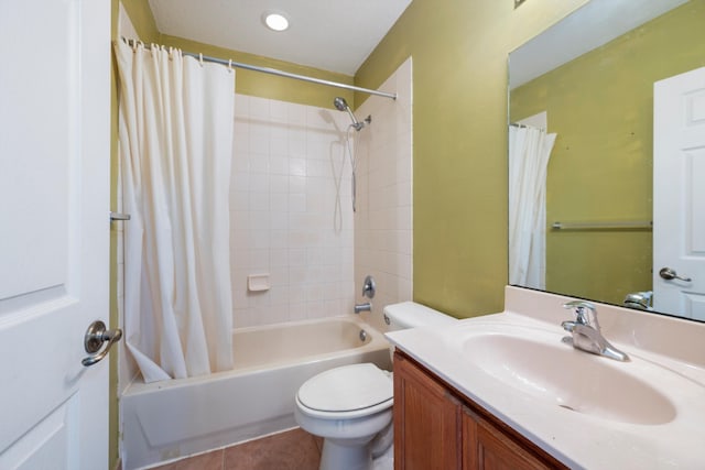 full bathroom featuring tile patterned flooring, shower / bath combo, vanity, and toilet