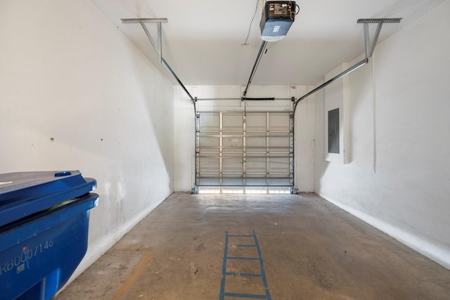 garage with electric panel and a garage door opener