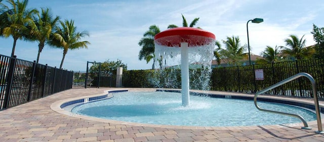 view of swimming pool featuring pool water feature