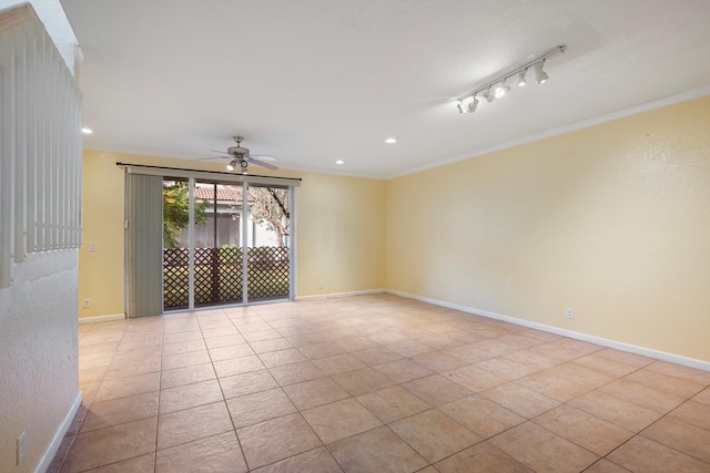 tiled spare room with ceiling fan, ornamental molding, and rail lighting