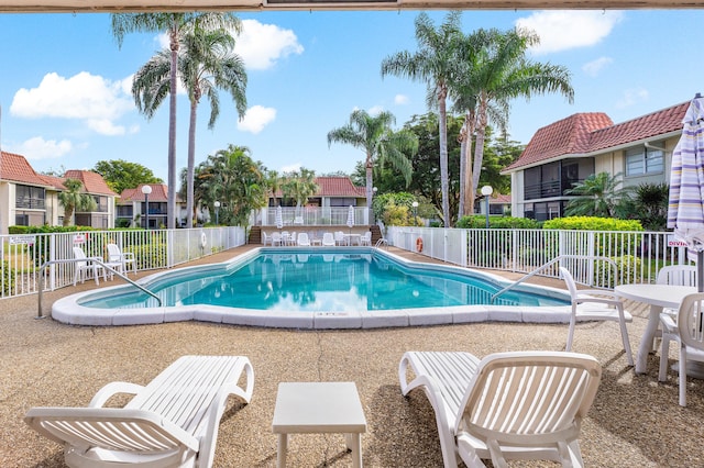 1124 NW 13th St Unit 218A, Boca Raton, FL 33486 - community pool with a patio area and a residential view