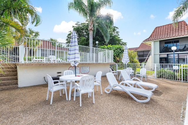 view of patio featuring a balcony